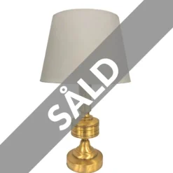 Taylor Lampfot, mässing